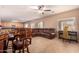 Gathering room with leather sectional sofa and built-in entertainment center at 35834 W Cartegna Ln, Maricopa, AZ 85138