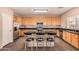 Spacious kitchen with granite countertops and stainless steel appliances at 35834 W Cartegna Ln, Maricopa, AZ 85138