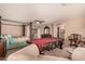 Main bedroom features a large bed, pool table, and access to bathroom at 35834 W Cartegna Ln, Maricopa, AZ 85138