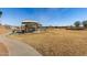 Community park with playground and shaded seating at 35834 W Cartegna Ln, Maricopa, AZ 85138