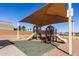 Park playground with shade structures and slides at 35834 W Cartegna Ln, Maricopa, AZ 85138