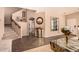 Elegant staircase with carpeted steps and decorative wall art at 35834 W Cartegna Ln, Maricopa, AZ 85138