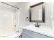Updated bathroom featuring a tub, toilet, vanity, and modern fixtures at 415 W Midland Ln, Gilbert, AZ 85233