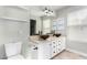 Bathroom featuring dual vessel sinks, granite countertops, and modern finishes at 415 W Midland Ln, Gilbert, AZ 85233