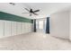 Spacious bedroom featuring large windows with modern trim and new carpet at 415 W Midland Ln, Gilbert, AZ 85233