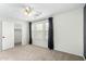 Carpeted bedroom with window and walk-in closet at 415 W Midland Ln, Gilbert, AZ 85233