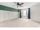 Spacious bedroom featuring large windows with modern trim and new carpet at 415 W Midland Ln, Gilbert, AZ 85233