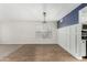 Dining room with hardwood floors, elegant chandelier, and decorative wainscoting at 415 W Midland Ln, Gilbert, AZ 85233