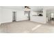 Bright, spacious living room features carpeting and an open floor plan at 415 W Midland Ln, Gilbert, AZ 85233