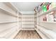 Large walk-in pantry with ample shelving for storage at 415 W Midland Ln, Gilbert, AZ 85233