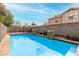 Sparkling swimming pool surrounded by privacy fence and well-maintained landscaping at 415 W Midland Ln, Gilbert, AZ 85233