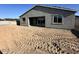 Exterior backyard featuring a grey stucco home, a blank canvas for personalization at 5510 W Paseo Way, Laveen, AZ 85339
