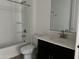 A clean, well-lit bathroom featuring a shower-tub combo and a modern vanity at 5510 W Paseo Way, Laveen, AZ 85339