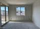 Bedroom with sliding glass doors and white drywall walls at 5510 W Paseo Way, Laveen, AZ 85339