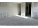 Unfinished bedroom featuring bare drywall walls and closet, ready for personalized design at 5510 W Paseo Way, Laveen, AZ 85339