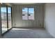 A bedroom offers views of the back yard and sliding glass door for easy access to the outdoors at 5510 W Paseo Way, Laveen, AZ 85339
