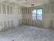Unfinished bedroom featuring bare drywall walls and window, ready for personalized design at 5510 W Paseo Way, Laveen, AZ 85339