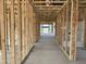 A spacious interior under construction, featuring wood framing and an open floor plan with visible utilities at 5510 W Paseo Way, Laveen, AZ 85339