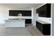 Well-lit kitchen with elegant dark cabinets, ample counter space and a functional island at 5510 W Paseo Way, Laveen, AZ 85339