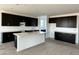 New kitchen boasting stylish cabinets, a large island and quartz countertops at 5510 W Paseo Way, Laveen, AZ 85339