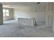 Open-concept living area featuring high ceilings, large windows, and bare walls ready for customization at 5510 W Paseo Way, Laveen, AZ 85339