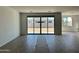 Spacious living area with sliding glass doors providing a view of the backyard at 5510 W Paseo Way, Laveen, AZ 85339