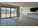 Open-concept living area features tile flooring and sliding glass doors for outdoor access at 5510 W Paseo Way, Laveen, AZ 85339