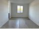 Bright and spacious room with tile flooring and a large window offers abundant natural light at 5510 W Paseo Way, Laveen, AZ 85339