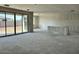Large living room featuring a sliding glass door providing seamless indoor/outdoor living at 5510 W Paseo Way, Laveen, AZ 85339