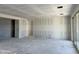 Large living room with white drywall and sliding glass doors at 5510 W Paseo Way, Laveen, AZ 85339