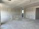 Spacious living room featuring drywall ready for customization and ample natural light at 5510 W Paseo Way, Laveen, AZ 85339