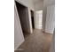 Hallway with carpet, doors to bedrooms and a bathroom at 5742 W Shannon St, Chandler, AZ 85226