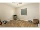 Bright bedroom with carpeted floor, ceiling fan and window coverings at 728 E Payton St, San Tan Valley, AZ 85140