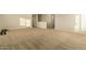 Bright bedroom with carpeting and access to hallway at 728 E Payton St, San Tan Valley, AZ 85140