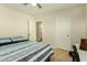 Bedroom with a bed, door to bathroom and a desk at 728 E Payton St, San Tan Valley, AZ 85140