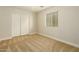 Simple bedroom with double door closet and window coverings at 728 E Payton St, San Tan Valley, AZ 85140