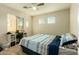 Bedroom with a bed, desk and window coverings at 728 E Payton St, San Tan Valley, AZ 85140