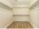 Large walk-in closet with double hanging rods and carpeted floor at 728 E Payton St, San Tan Valley, AZ 85140