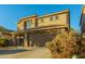 Two-story house with attached garage and landscaping at 728 E Payton St, San Tan Valley, AZ 85140