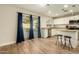 Bright kitchen with island and sliding door to backyard at 728 E Payton St, San Tan Valley, AZ 85140