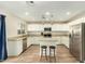 Spacious kitchen with island, granite counters, and stainless steel appliances at 728 E Payton St, San Tan Valley, AZ 85140