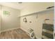 Laundry room with tile flooring, shelving and window at 728 E Payton St, San Tan Valley, AZ 85140