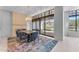 Elegant dining room with a large table and access to a patio at 8 E Biltmore Est # 117, Phoenix, AZ 85016