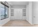 Guest room featuring a built-in wall bed and ample storage at 8 E Biltmore Est # 117, Phoenix, AZ 85016