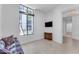 Bright guest room with comfy seating and large window at 8 E Biltmore Est # 117, Phoenix, AZ 85016