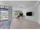 Bright living room with hardwood floors, grand piano, and large windows at 8 E Biltmore Est # 117, Phoenix, AZ 85016