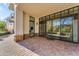 Private patio with brick pavers and sliding glass doors at 8 E Biltmore Est # 117, Phoenix, AZ 85016