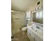 Compact bathroom featuring a tiled shower, white vanity, and medicine cabinet at 839 Leisure World --, Mesa, AZ 85206