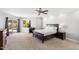 Large bedroom with plush carpeting and sliding door to patio at 8466 E San Benito Dr, Scottsdale, AZ 85258