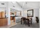 Kitchen and dining area with contemporary light fixtures at 8466 E San Benito Dr, Scottsdale, AZ 85258